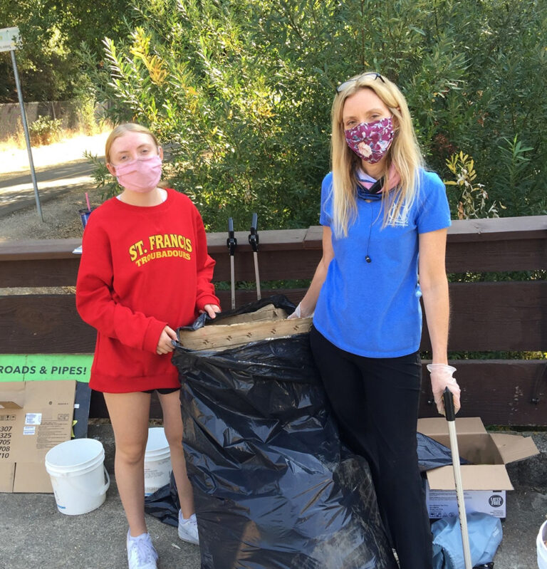 Carolyn and her daughter participate in the American River Conservancy's clean-up day.
