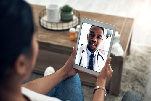 patient in videocall with doctor on a tablet.