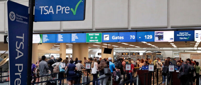 Airport counter with a TSA PreCheck sign